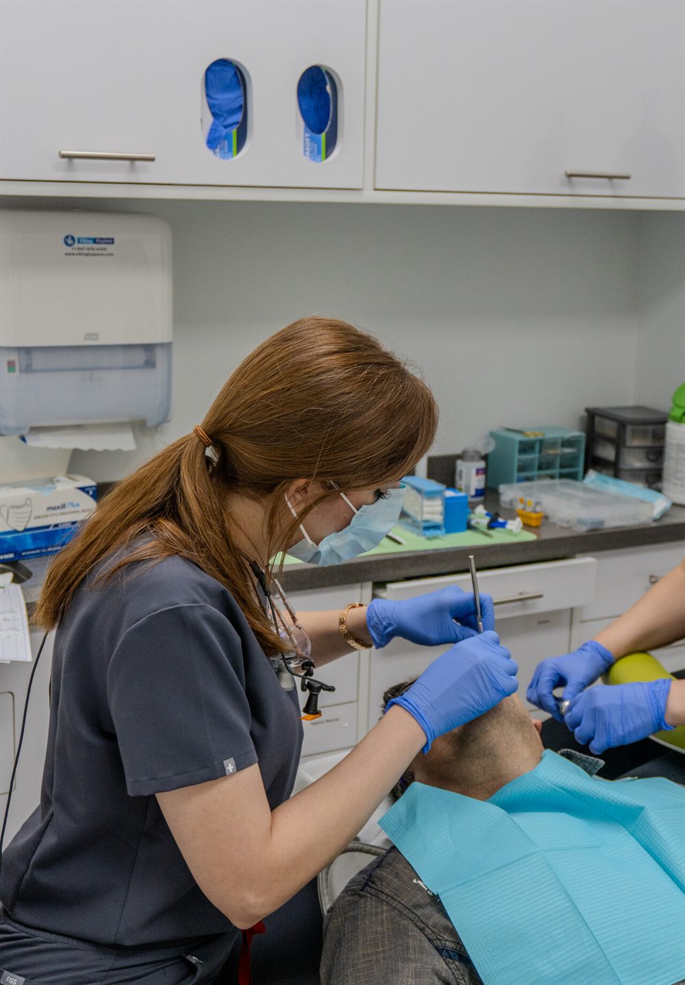 Limegreen Dental hygienist gently treating a patient at the Hamilton Mountain clinic
